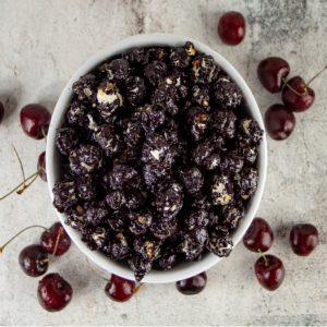 Bowl of chocolate-covered cherries and popcorn.